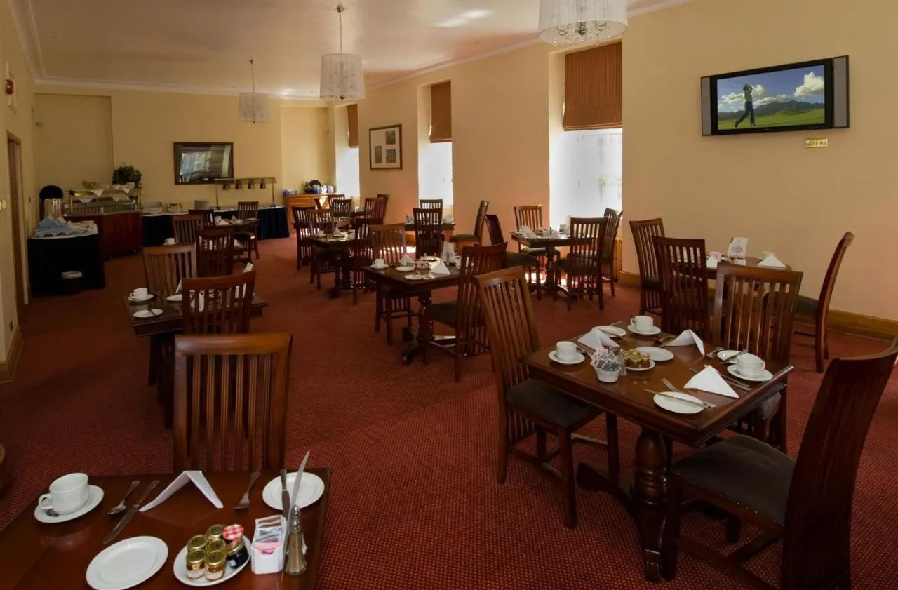 Dining room with wooden tables at Aberdeen Douglas Hotel, Aberdeen